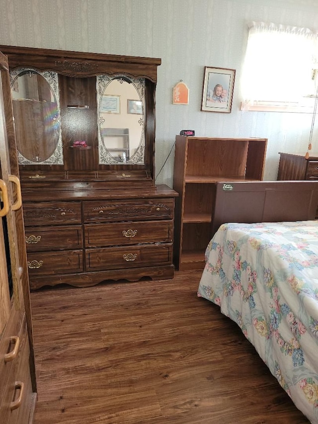 bedroom with dark wood-type flooring