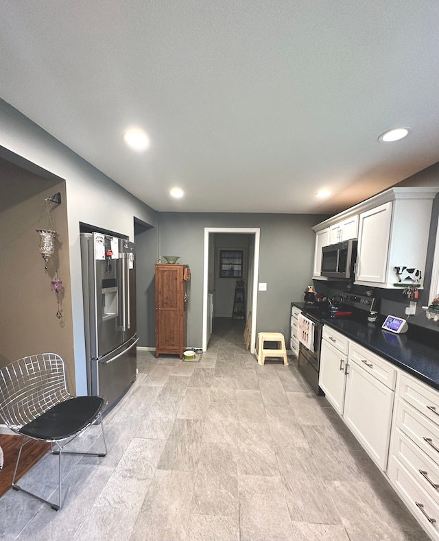 kitchen with white cabinets and stainless steel appliances