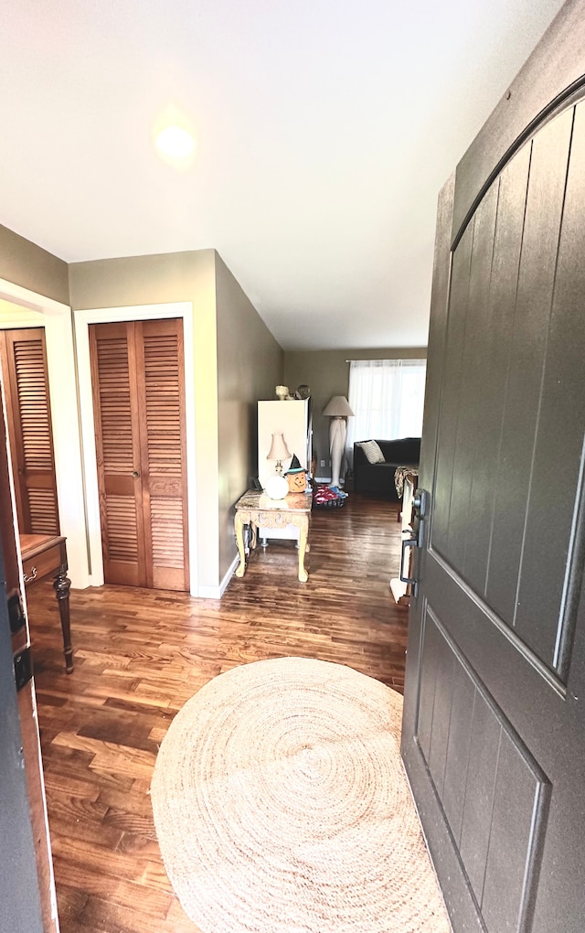 foyer entrance with dark hardwood / wood-style flooring