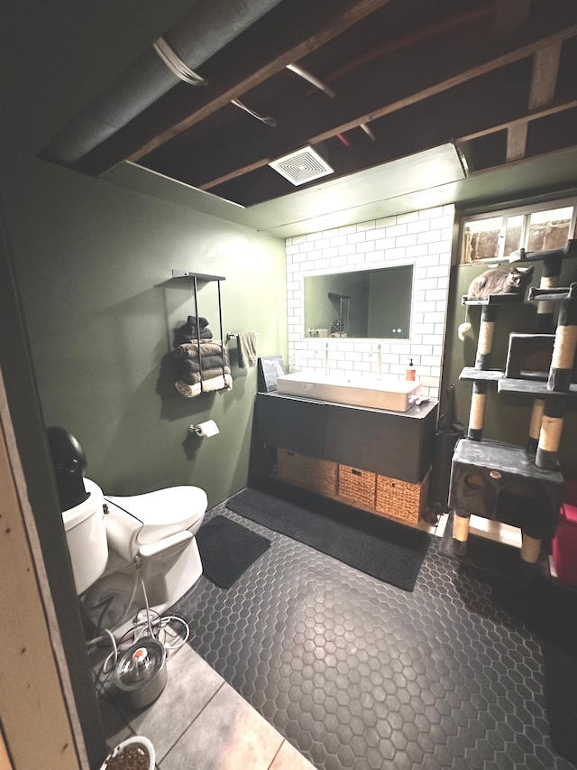 bathroom with tile patterned flooring and toilet