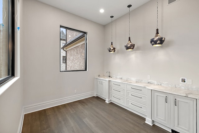 interior space with vanity and wood-type flooring