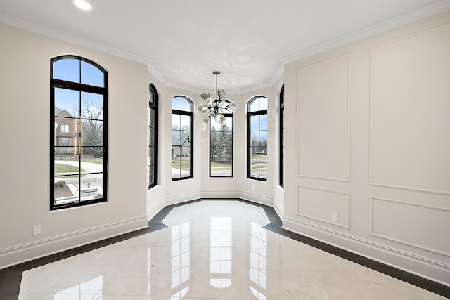 unfurnished dining area with a notable chandelier and crown molding