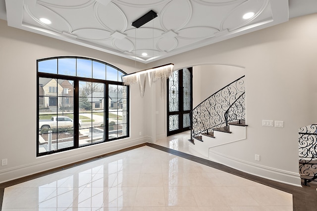 foyer featuring french doors and light tile patterned flooring