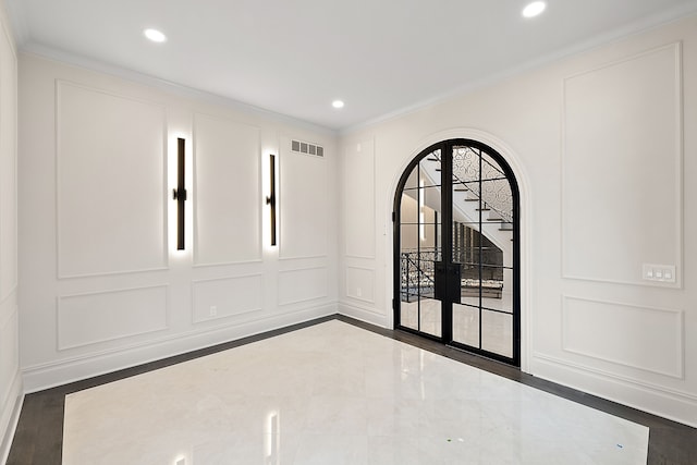 spare room featuring crown molding and dark wood-type flooring