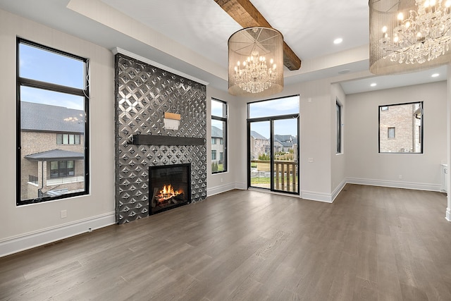 unfurnished living room with plenty of natural light and dark wood-type flooring