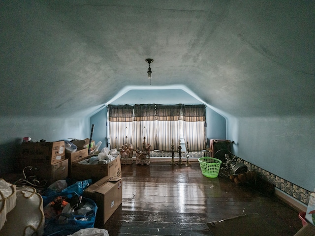 bonus room featuring dark hardwood / wood-style flooring and vaulted ceiling