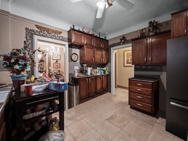 kitchen with stainless steel fridge, a textured ceiling, dark brown cabinetry, and backsplash