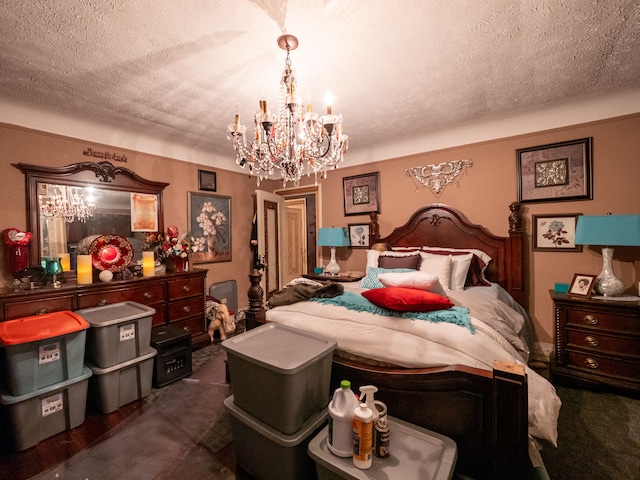 bedroom featuring a textured ceiling and a chandelier