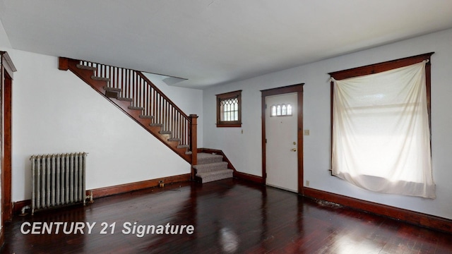 entryway featuring radiator heating unit and dark hardwood / wood-style floors