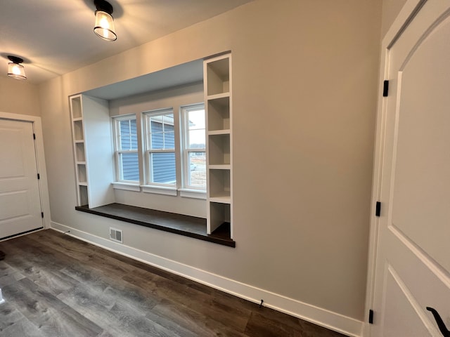 mudroom with visible vents, dark wood finished floors, and baseboards