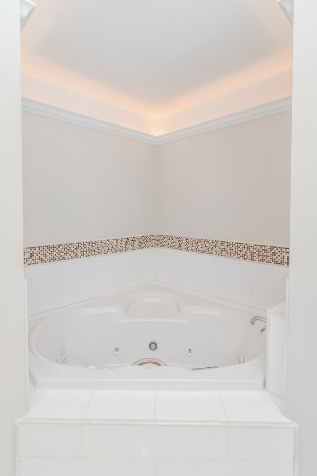 bathroom featuring a relaxing tiled tub