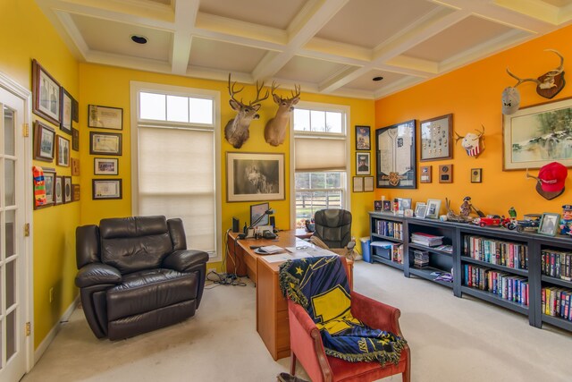 office space featuring beamed ceiling, plenty of natural light, light colored carpet, and coffered ceiling