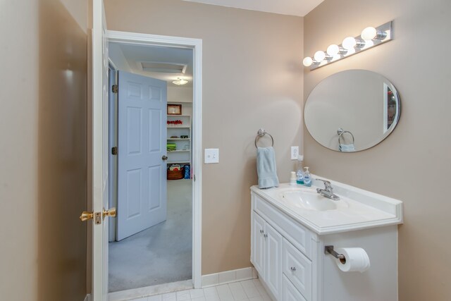 bathroom featuring tile patterned flooring and vanity