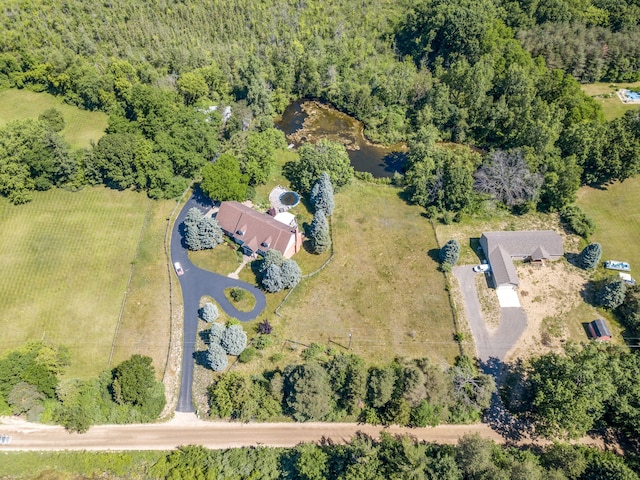 4090 Perryville Rd, Ortonville, MI 48462 - aerial view of property and surrounding area featuring a heavily wooded area