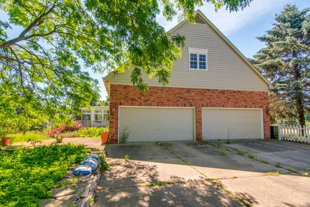 view of property exterior with a garage