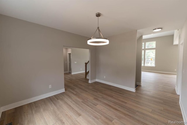 unfurnished room featuring wood-type flooring