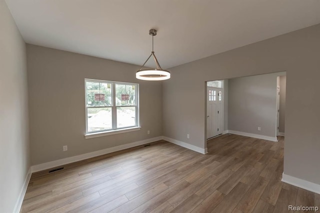 empty room featuring hardwood / wood-style flooring