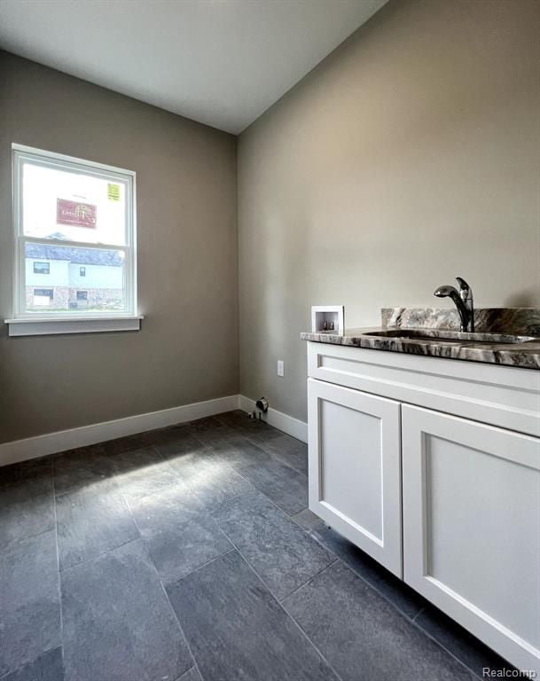 laundry room featuring cabinets, sink, and hookup for a washing machine