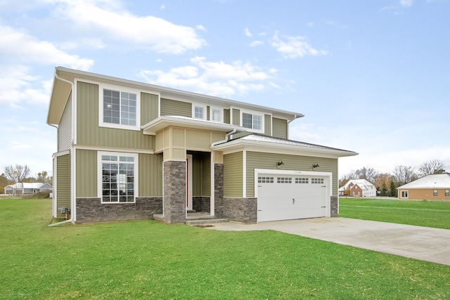 view of front facade with a front yard and a garage