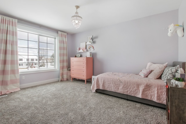 bedroom with carpet flooring and an inviting chandelier