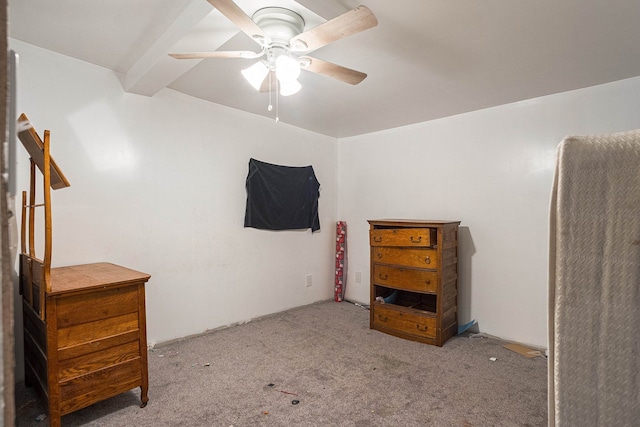 carpeted bedroom with beam ceiling and ceiling fan