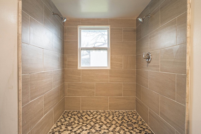 bathroom with tiled shower