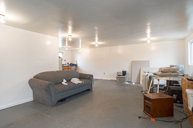 living room featuring concrete flooring