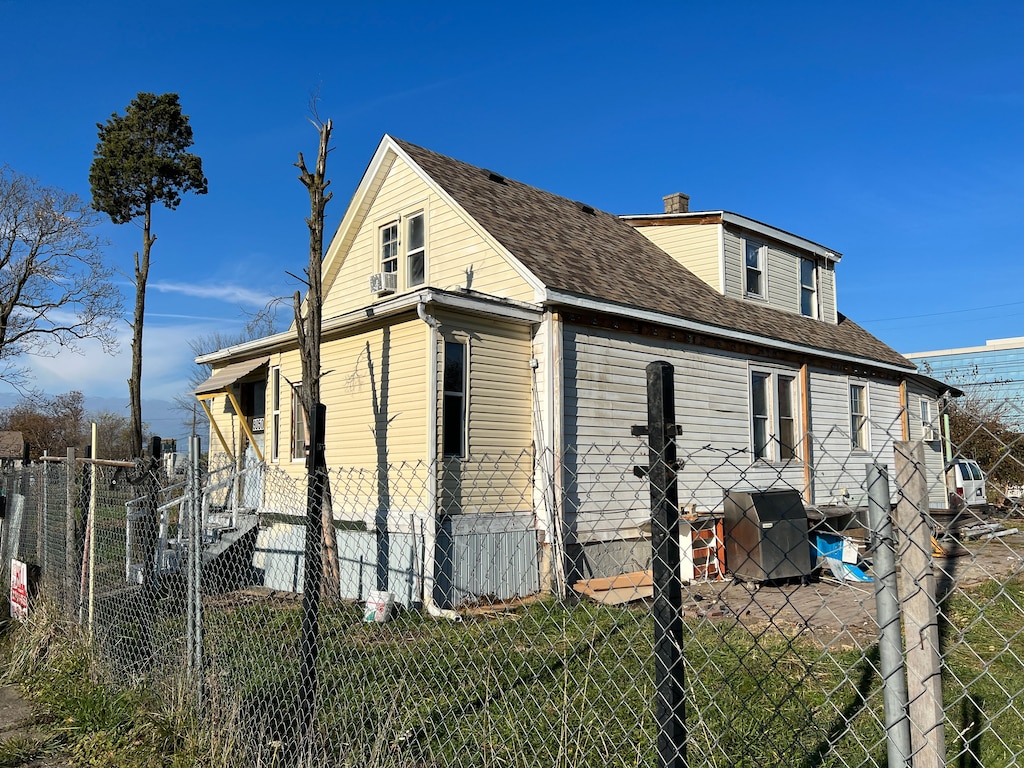 view of property exterior featuring a lawn