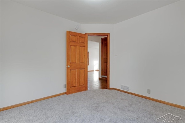 spare room with carpet floors