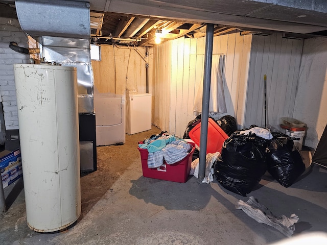 19356 Huntington Rd, Detroit, MI 48219 - unfinished basement featuring washing machine and clothes dryer, refrigerator, and water heater