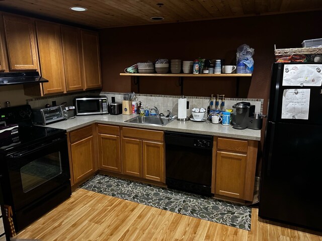 5900 Water Rd Unit 313, Rothbury, MI 49452 - kitchen featuring black appliances, a sink, range hood, light wood-type flooring, and wood ceiling