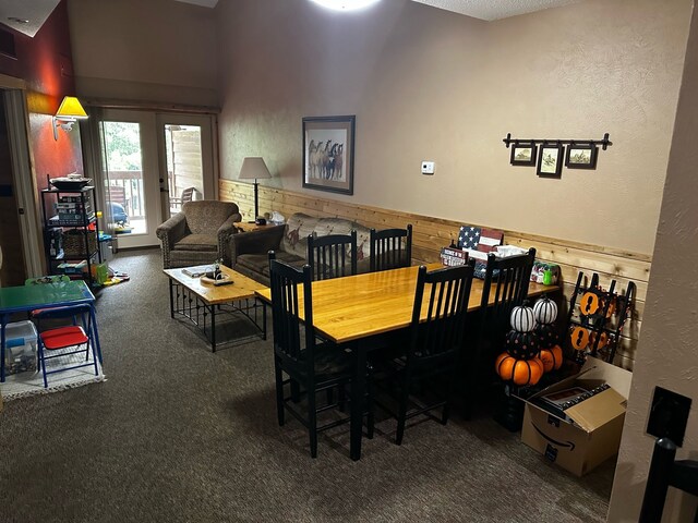 5900 Water Rd Unit 313, Rothbury, MI 49452 - carpeted dining space with a textured wall
