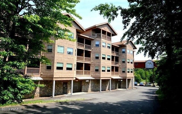 5900 Water Rd Unit 313, Rothbury, MI 49452 - view of apartment building / complex
