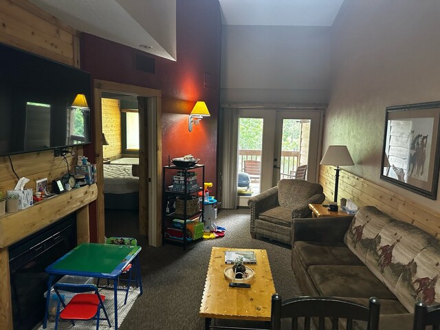 5900 Water Rd Unit 313, Rothbury, MI 49452 - living room with carpet, a fireplace, and french doors