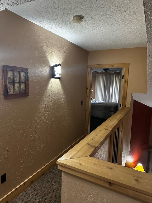 5900 Water Rd Unit 313, Rothbury, MI 49452 - stairs featuring a textured ceiling and a textured wall
