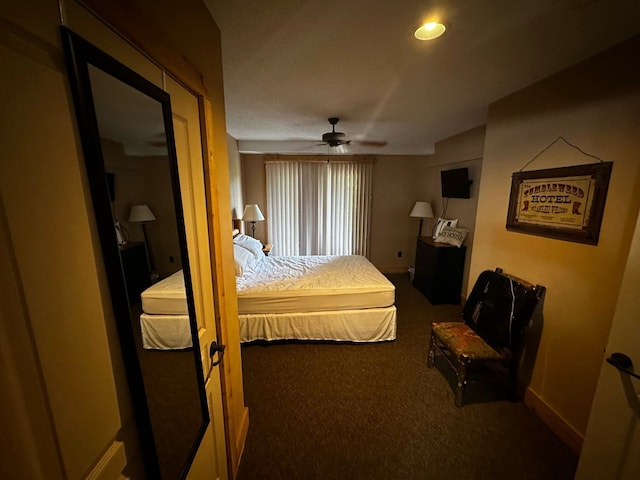 carpeted bedroom featuring ceiling fan