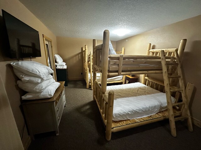 5900 Water Rd Unit 313, Rothbury, MI 49452 - carpeted bedroom with a textured ceiling