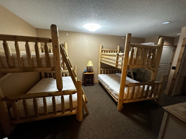5900 Water Rd Unit 313, Rothbury, MI 49452 - bedroom with carpet and a textured ceiling