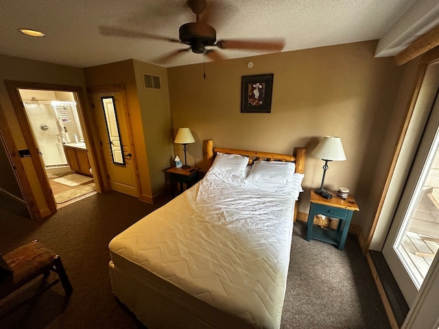 bedroom with connected bathroom, ceiling fan, a textured ceiling, and dark colored carpet