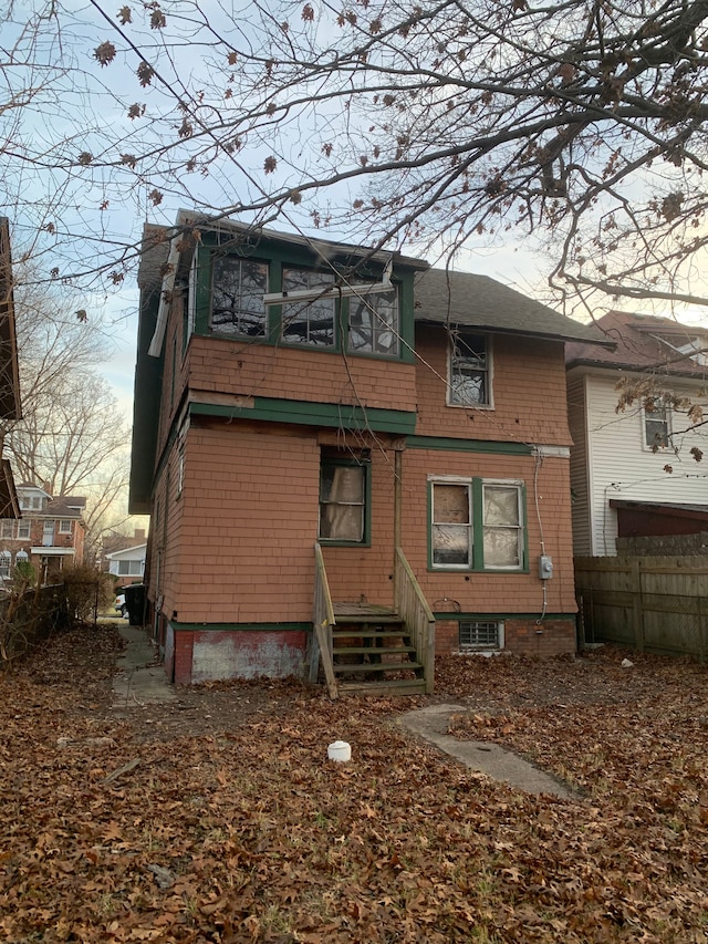 view of back house at dusk