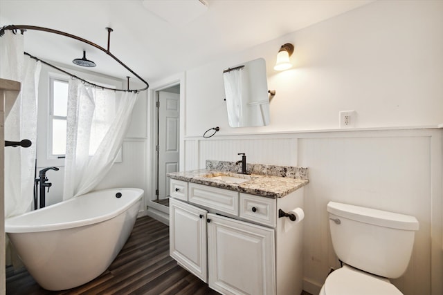 full bathroom with vanity, toilet, wood-type flooring, and independent shower and bath