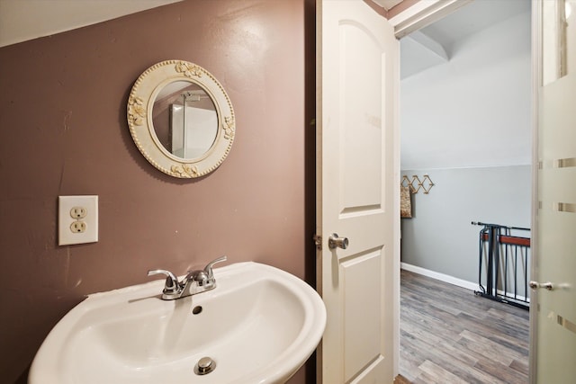 bathroom featuring hardwood / wood-style flooring and sink