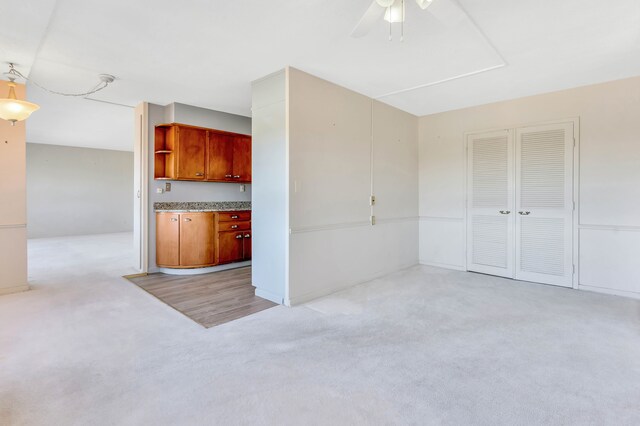 8900 E Jefferson Ave Unit 630-631, Detroit, MI 48214 - kitchen featuring light carpet, ceiling fan, and open shelves
