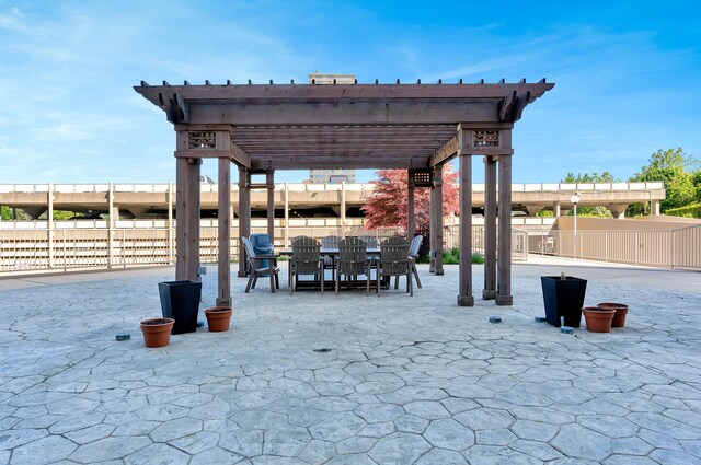 8900 E Jefferson Ave Unit 630-631, Detroit, MI 48214 - view of patio / terrace featuring a pergola and outdoor dining space