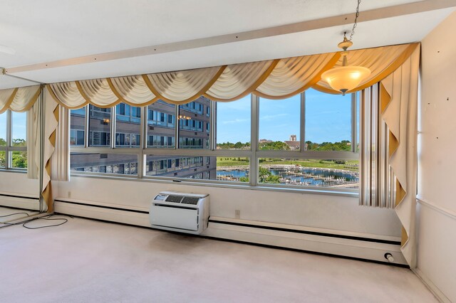 8900 E Jefferson Ave Unit 630-631, Detroit, MI 48214 - sunroom / solarium with a water view and a baseboard radiator