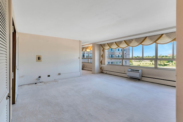 interior space with light colored carpet and a baseboard radiator