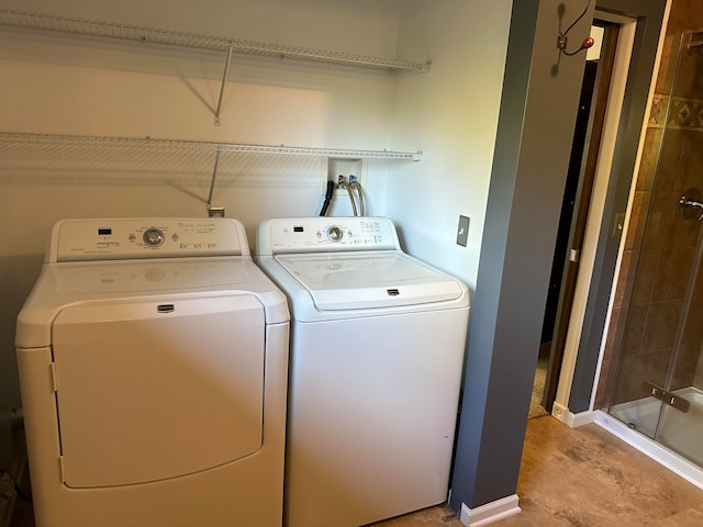 washroom with independent washer and dryer