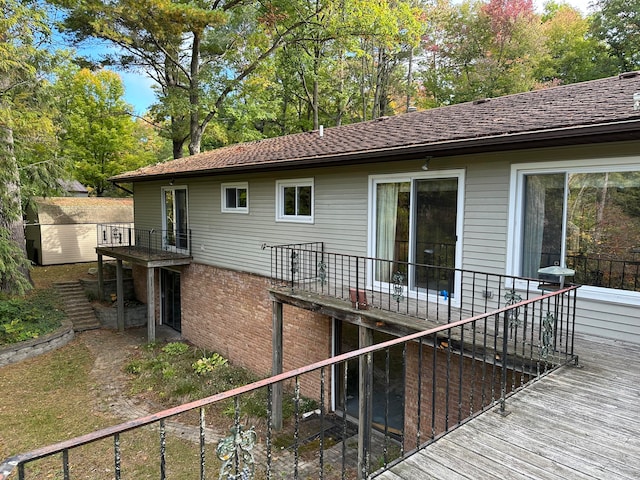 back of property with a balcony