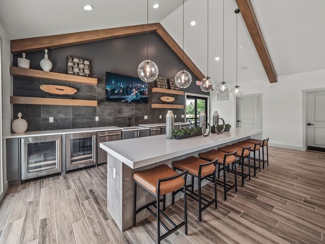 7893 Arimoore Dr, West Bloomfield, MI 48322 - indoor wet bar featuring beverage cooler, light wood finished floors, decorative light fixtures, and recessed lighting