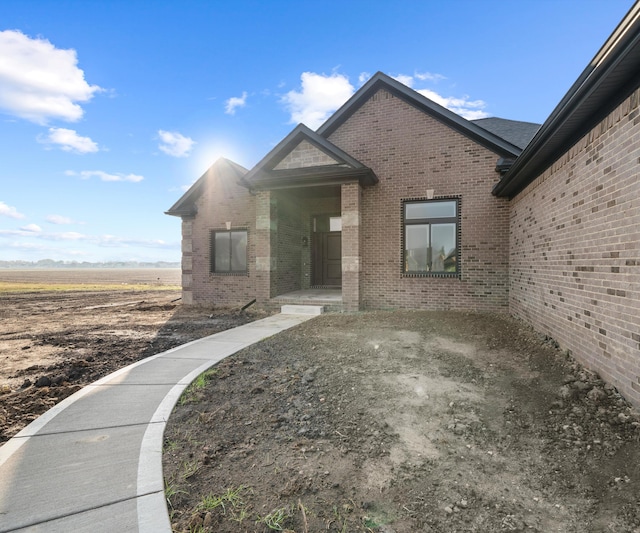 exterior space with brick siding